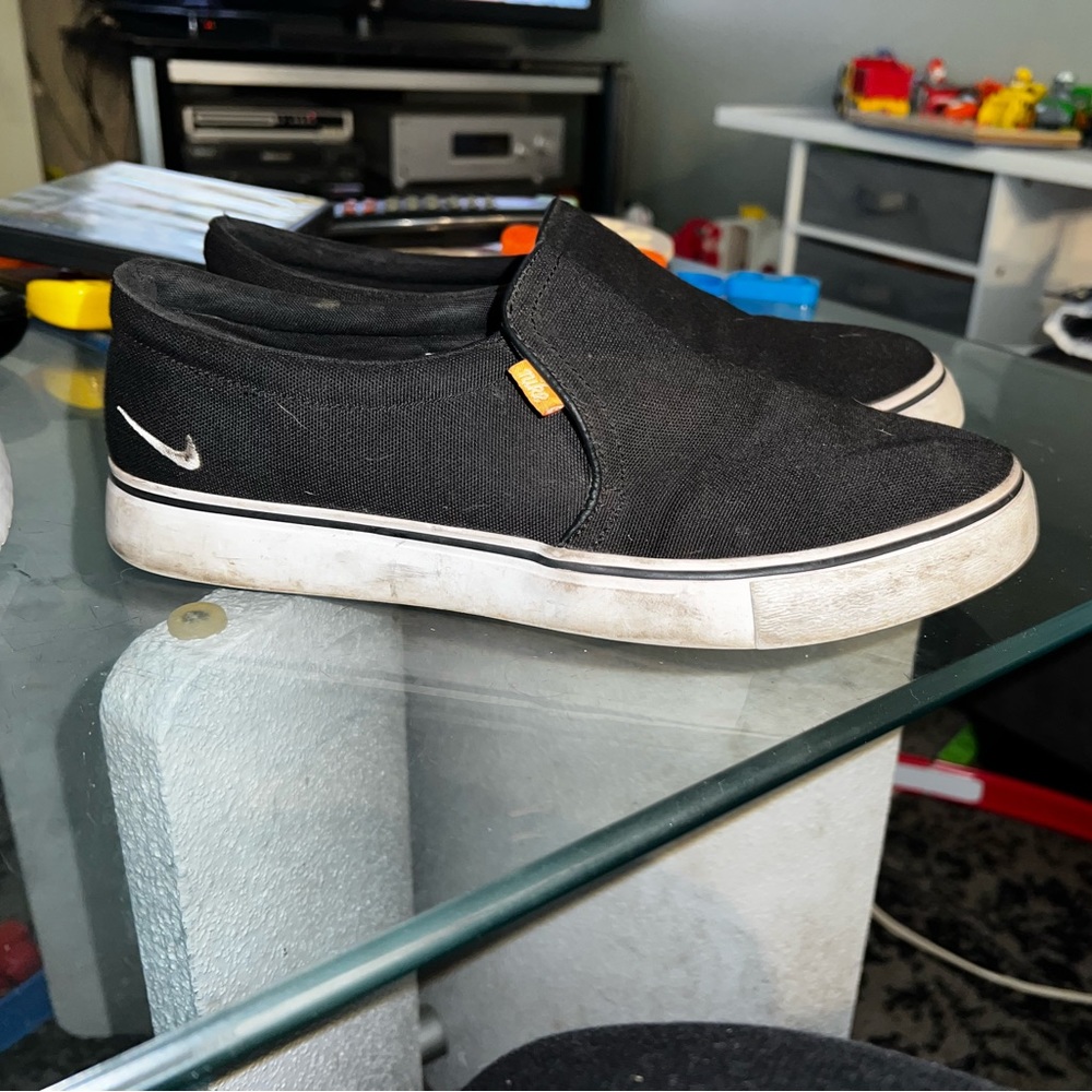Black Nike slip ons